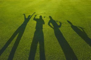 four golfers silhouette